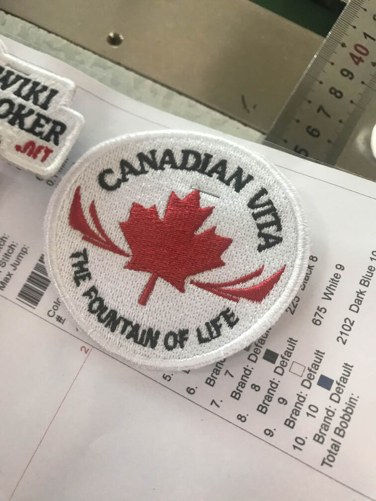Ảnh thêu logo Canadian Vita cho một công ty của Canada